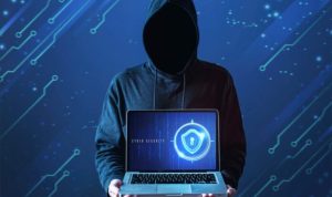 medium-shot-man-with-hoodie-holding-laptop-e1646646997479-1-696x465